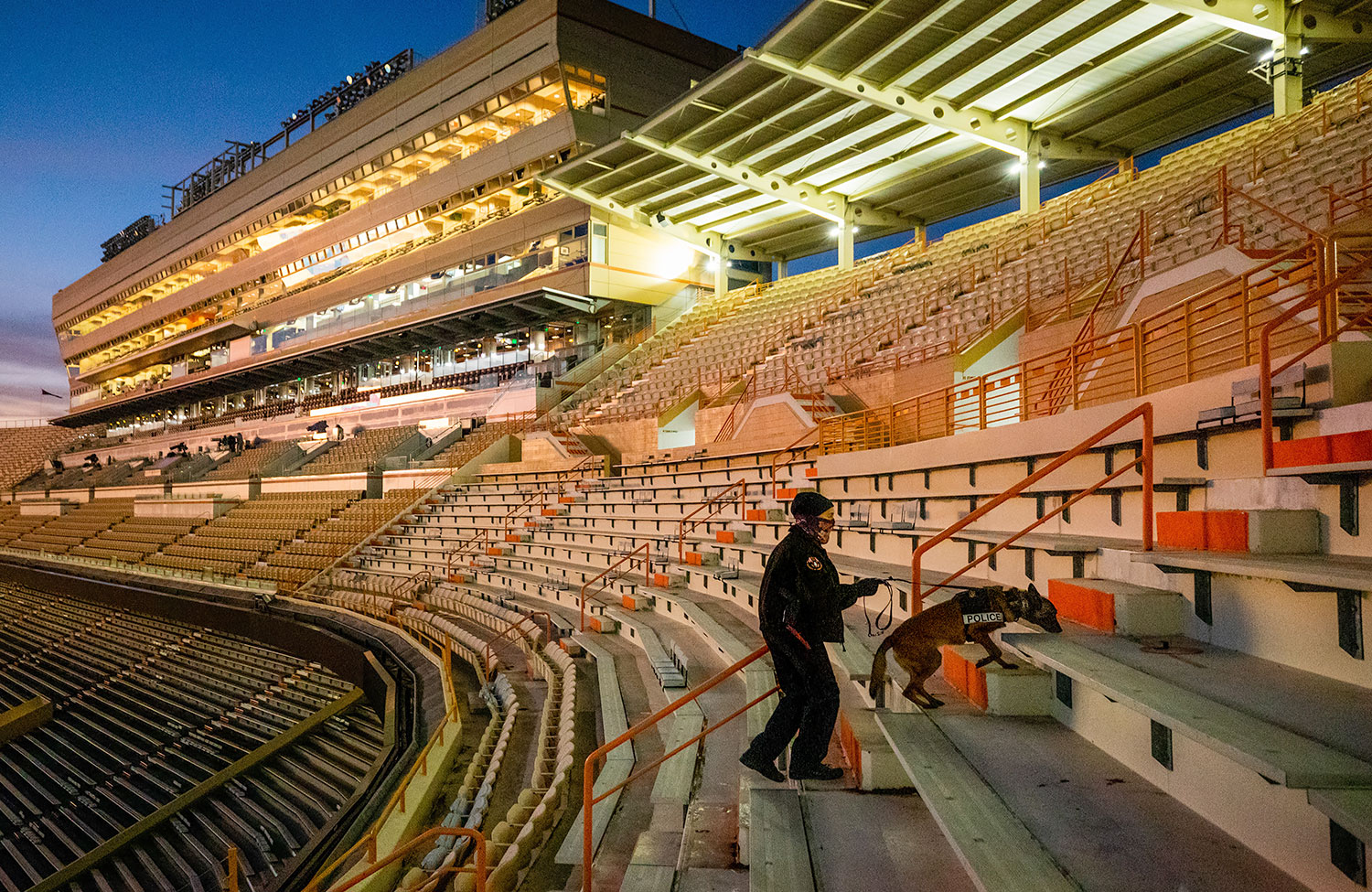 A UTPD officer and K-9 check Neyland Stadium prior to a football game
