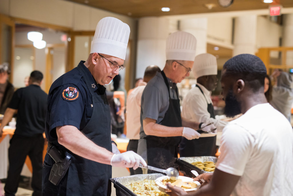 UTPD Chief Troy Lane serves students during a Pancake Supper in Hodges Library Galleria on April 25, 2019.
