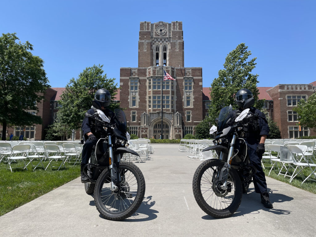 UTPD officers pose with Zero Motorcycles outside Ayres Hall